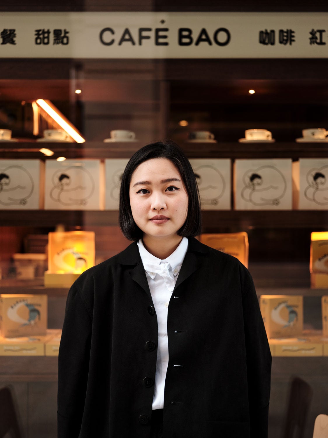A female chef looking to camera.