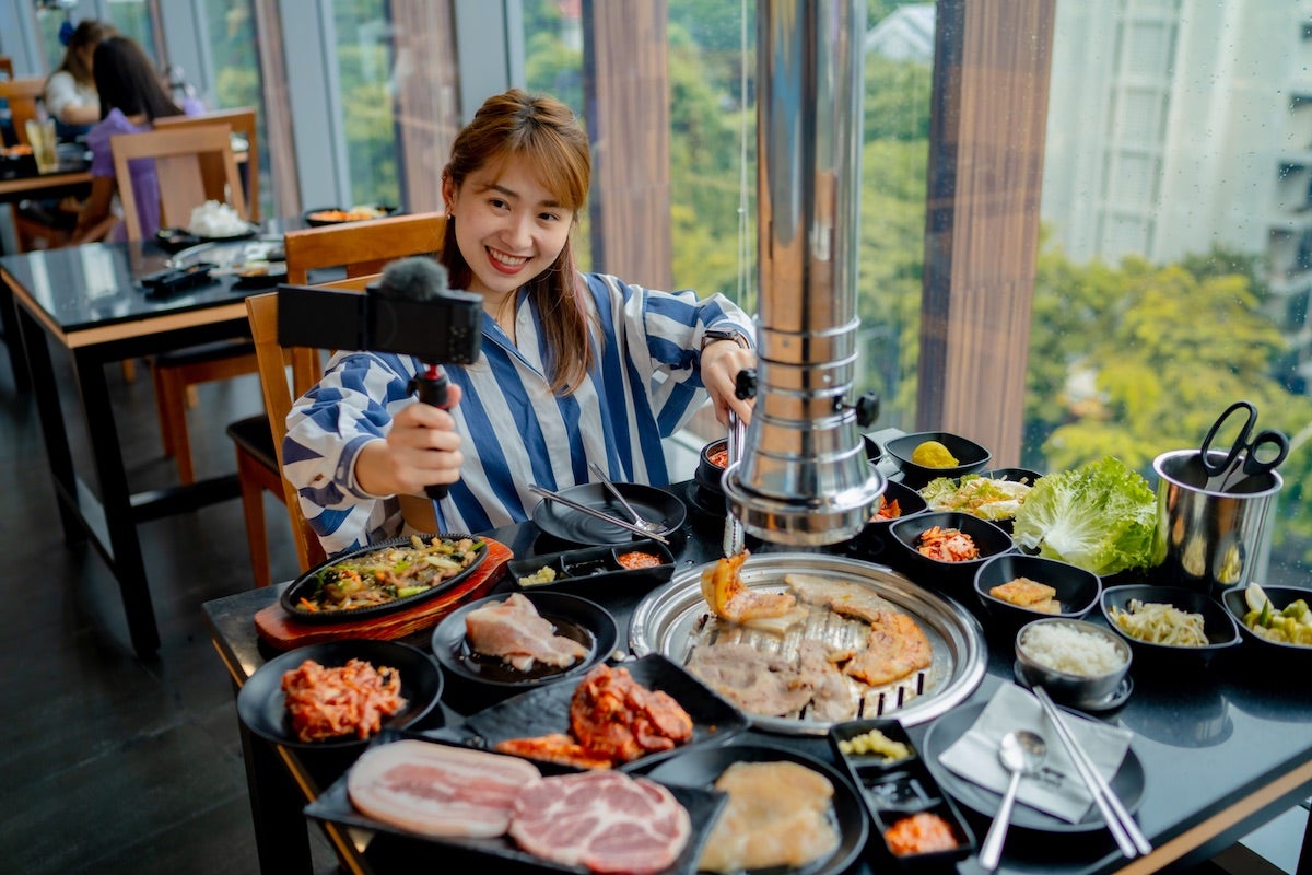 Girl having a video call while eating meal