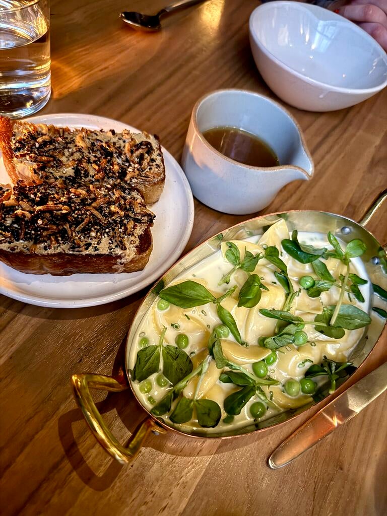 Délice de Bourgogne Mezza Luna Pasta and Puffed Grain Toast with Smoked Chicken Brodo, Buckwheat Butter at All Well