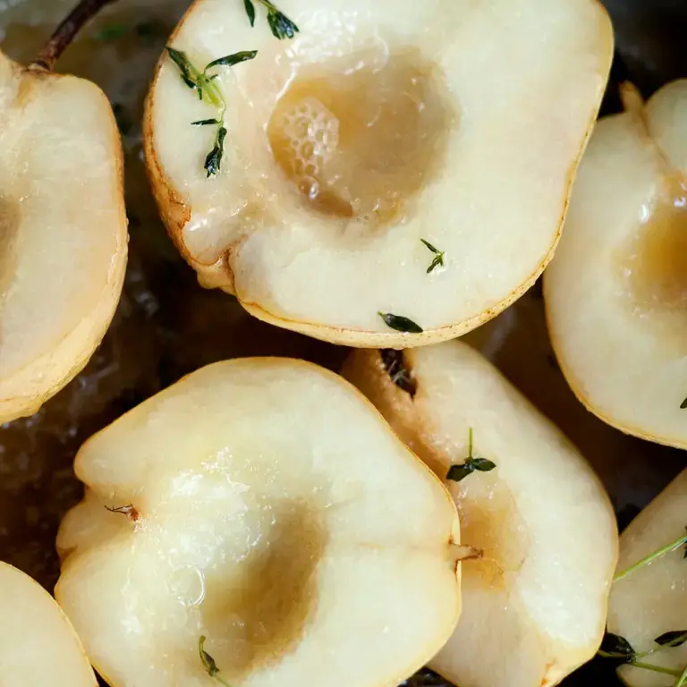a selection of peeled and halved overripe pears