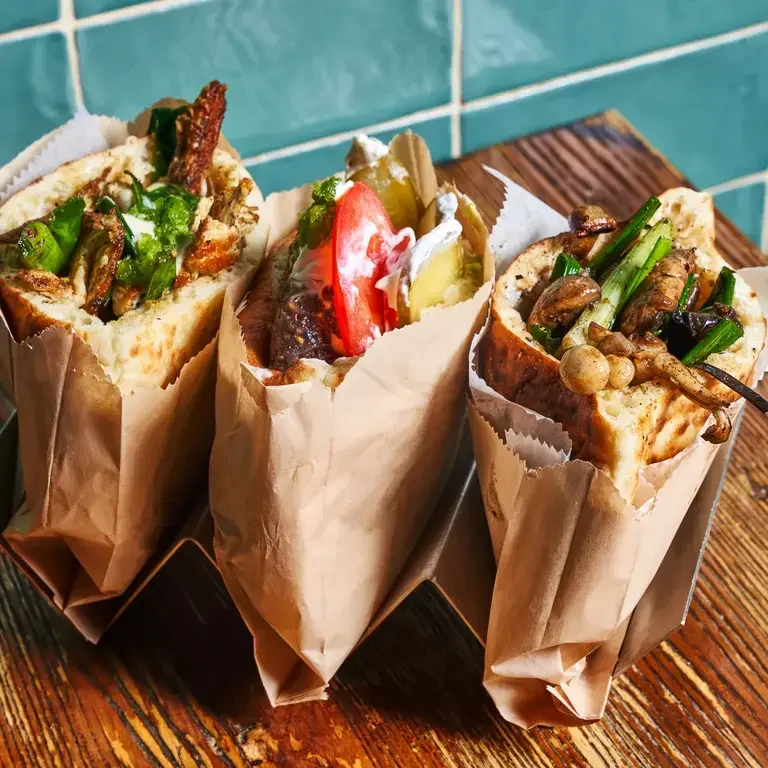 Rotisserie Broken Chicken, Lamb Kebab, and Wild Mushroom Pitas