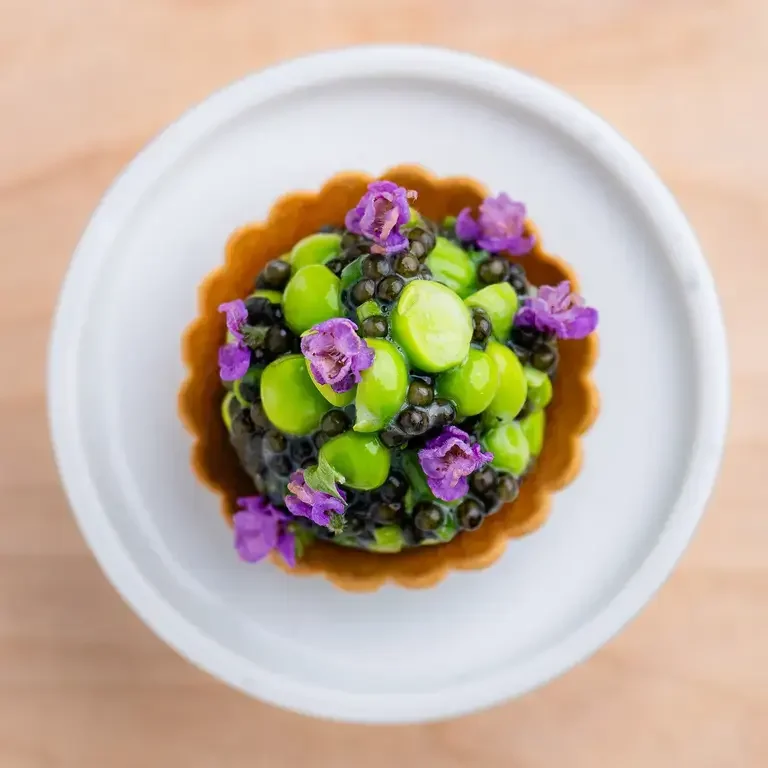 Iacopi Farm Pea Tartlet with Kaluga Caviar and Shiso Flower