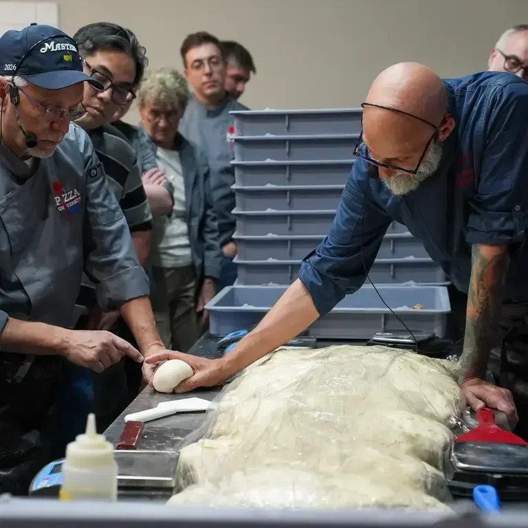 Enzo and Giulio Inspecting Dough