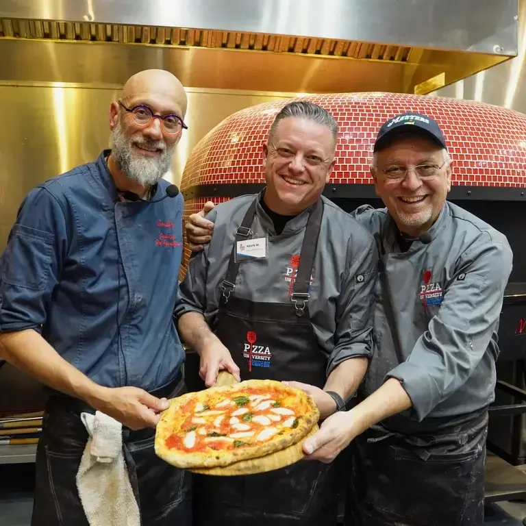 Writer Nevin Martell with His Pizza