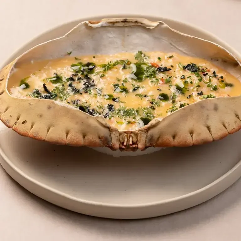 Noto's crab butter in a crab shell.