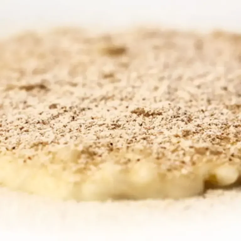 Carnaroli Rice with Birch Broth, Double Crème and Smoked Chestnut Powder