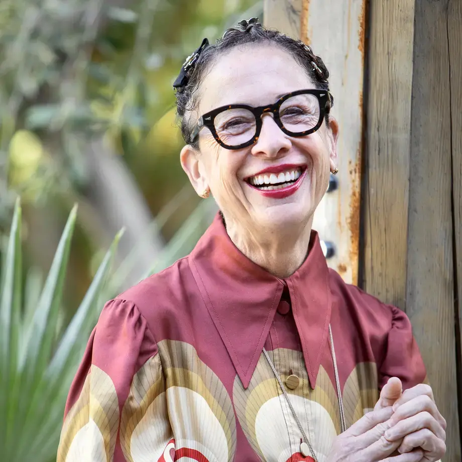 a potrait of Nancy Silverton in a brighly coloured top