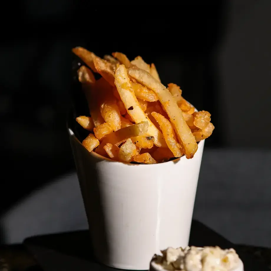 French Fries with Melted Leek Aioli at Apothecary Cocktail Bar