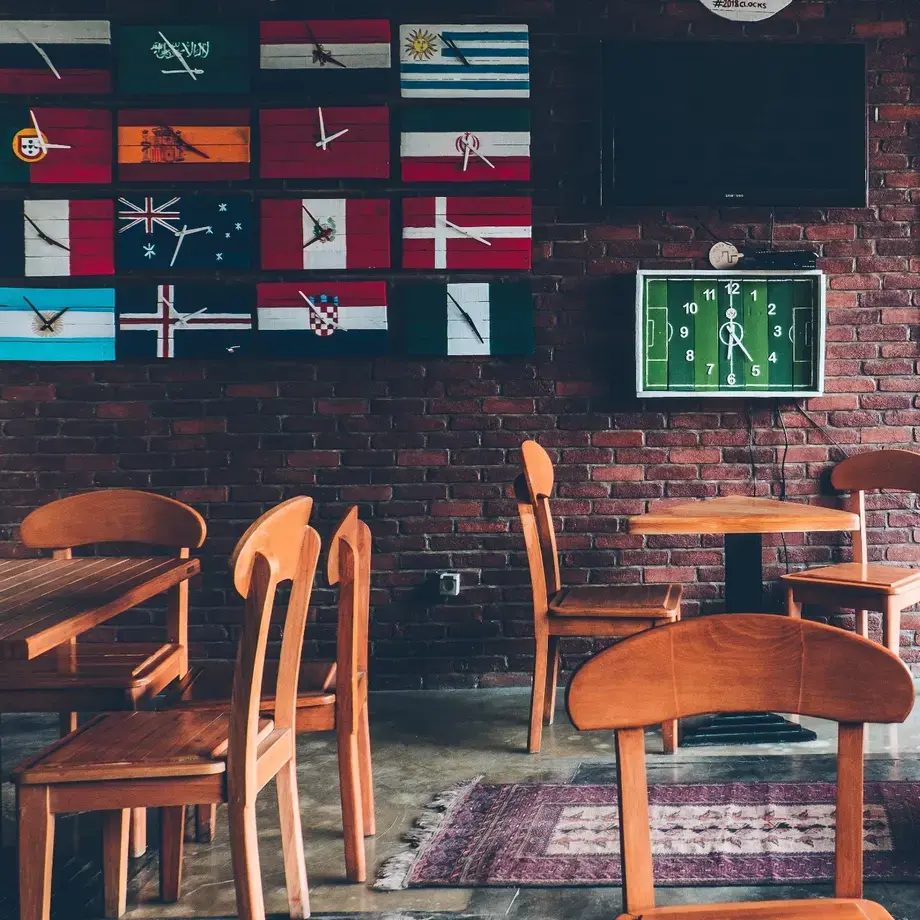 Restaurant with flags on the wall.