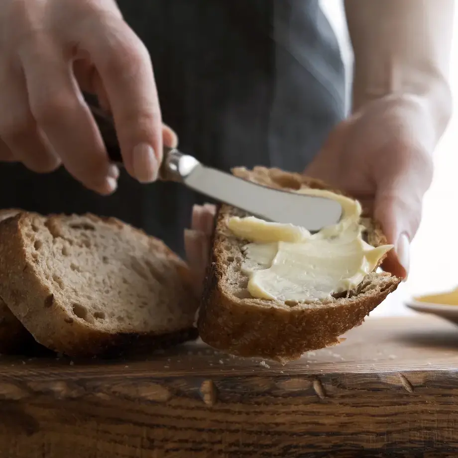 butter-being-spread-on-bread-with-butter-knife