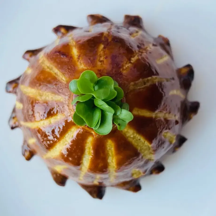 Dish of quail pithivier, mushroom duxelles, foie gras and Madeira sauce by chef Celia Stoeklin.
