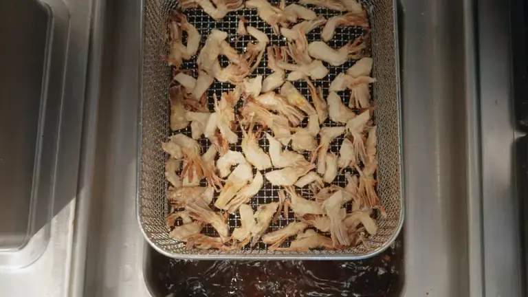 Artichokes in the fryer basket before cooking
