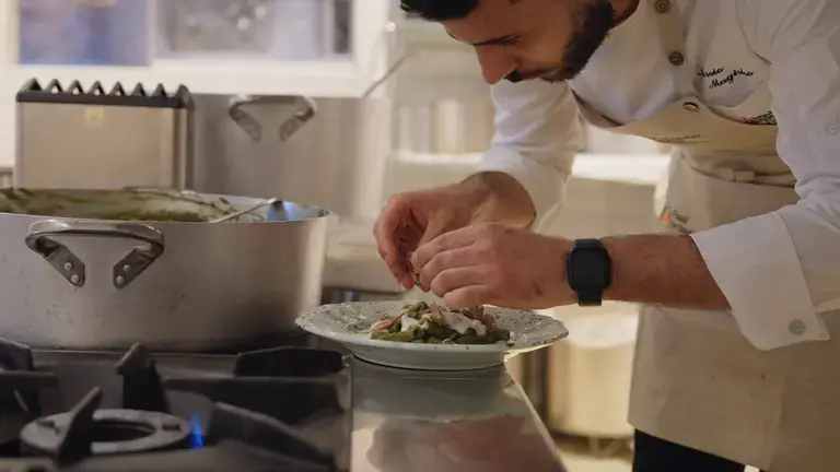 Chef plating the tortiglioni