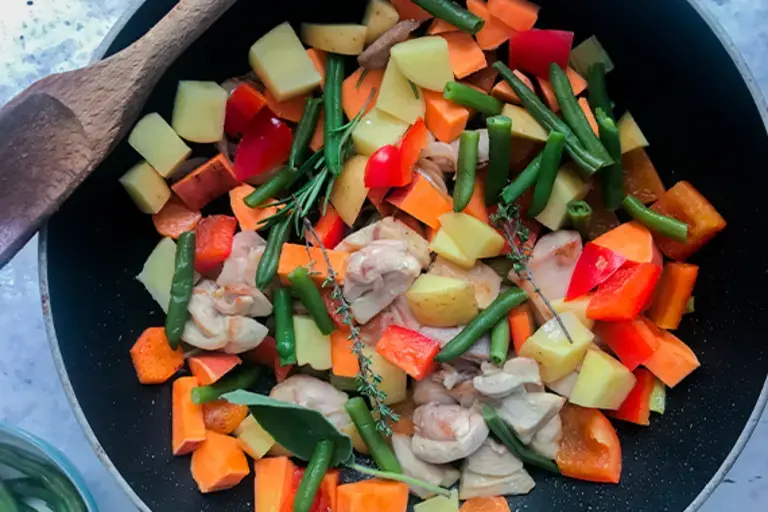 chicken and vegetables in a pan