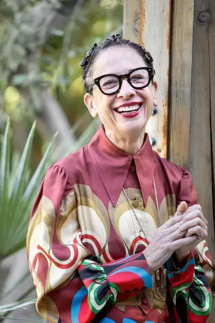a potrait of Nancy Silverton in a brighly coloured top