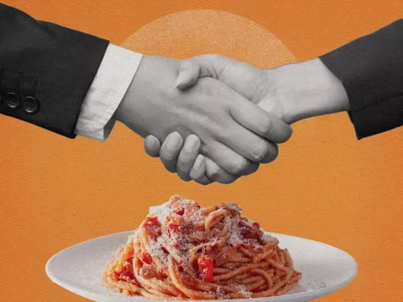 gastro-diplomacy-handsshake-over plate-of-spaghetti
