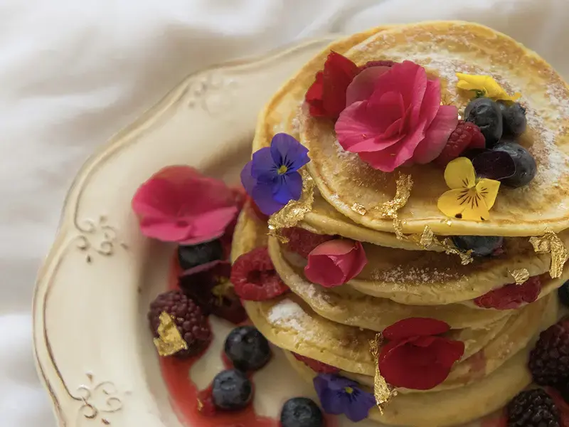 Pancakes and edible flowers.