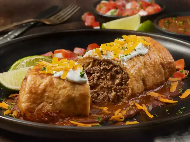 A chimichanga split in half.