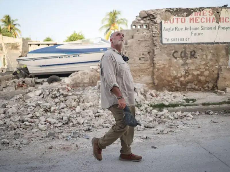 José Andrés waling through rubbles