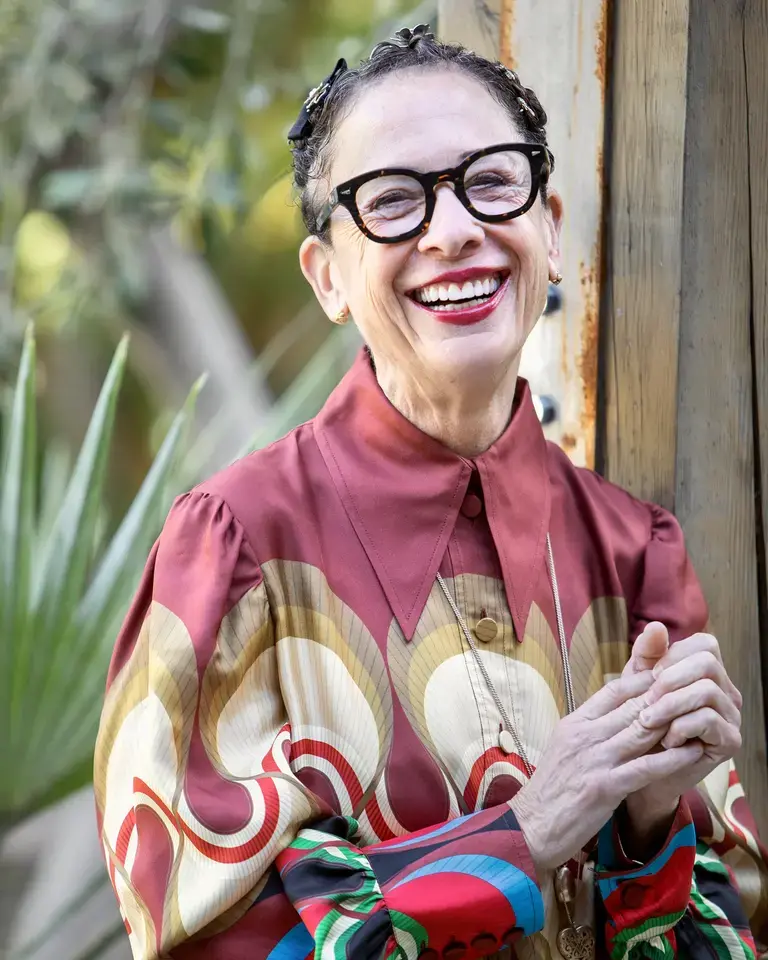a potrait of Nancy Silverton in a brighly coloured top