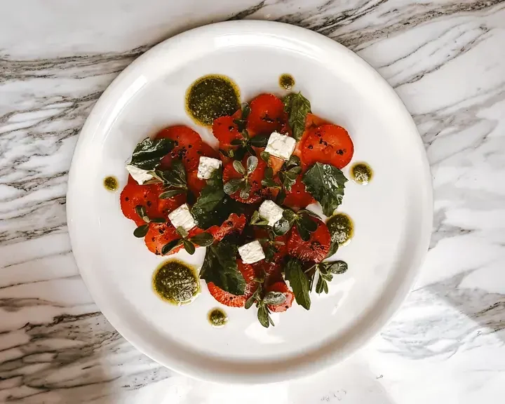 Purslane Salad with Strawberries, Feta, and Hoja Santa Pesto